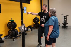 Coaching 50 Year Old Woman Getting Personalized Strength Coaching